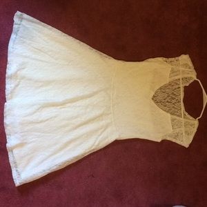 White lace mini dress with cap sleeves.